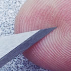 HOSDB P1/B Stab Test Blade shown against a finger tip
